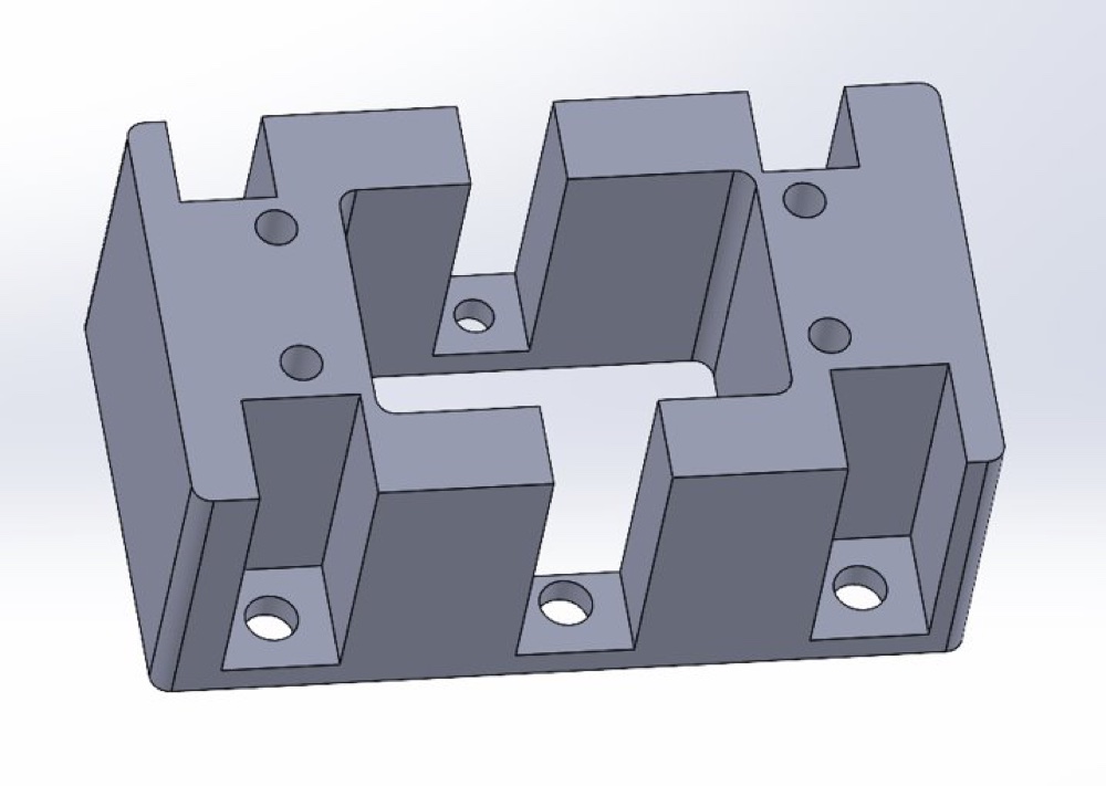 CAD model of the redesigned mount with hollowed-out pockets and screw holes
